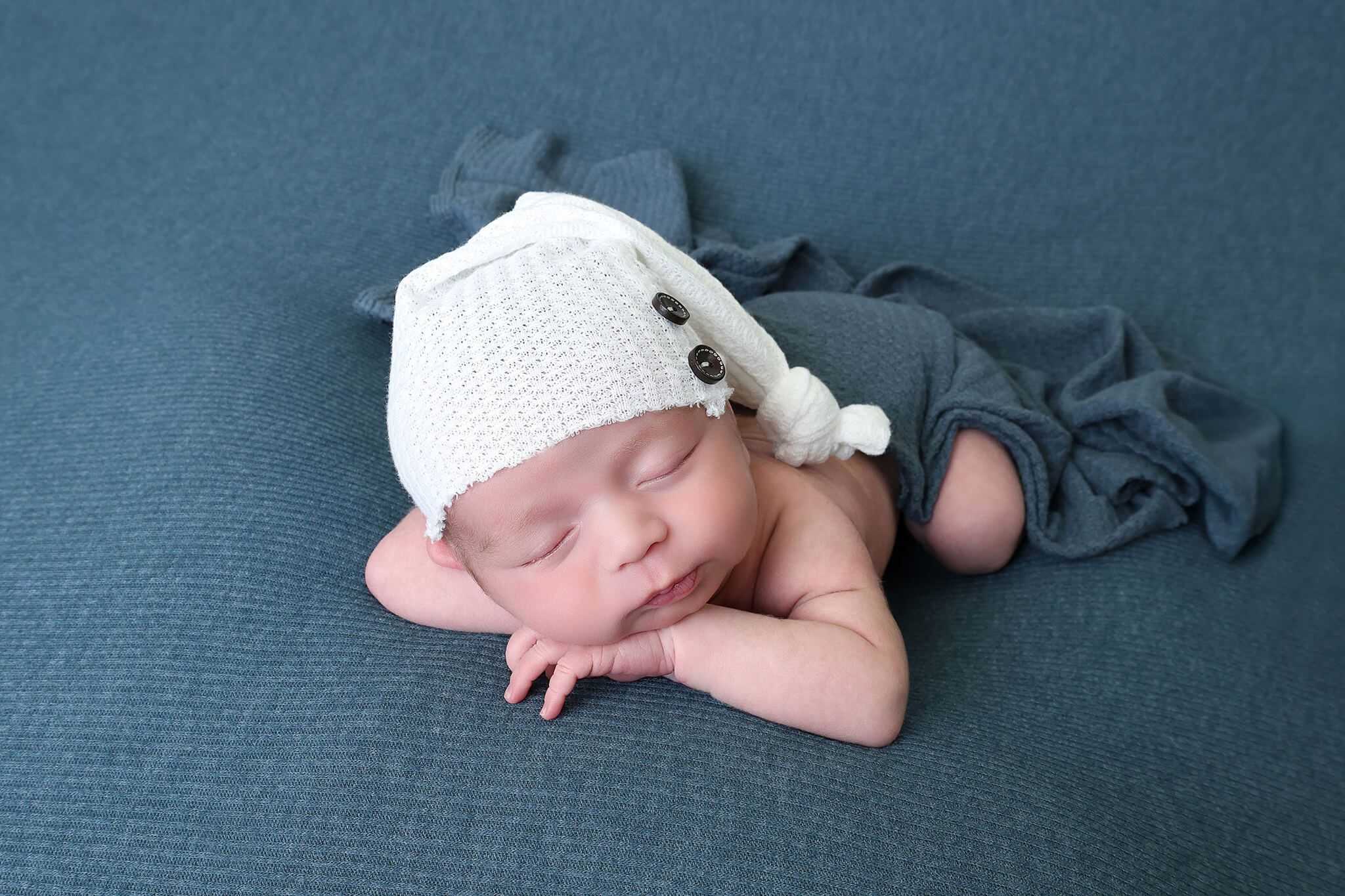 Sleepy baby boy during newborn photography session in Windsor Colorado