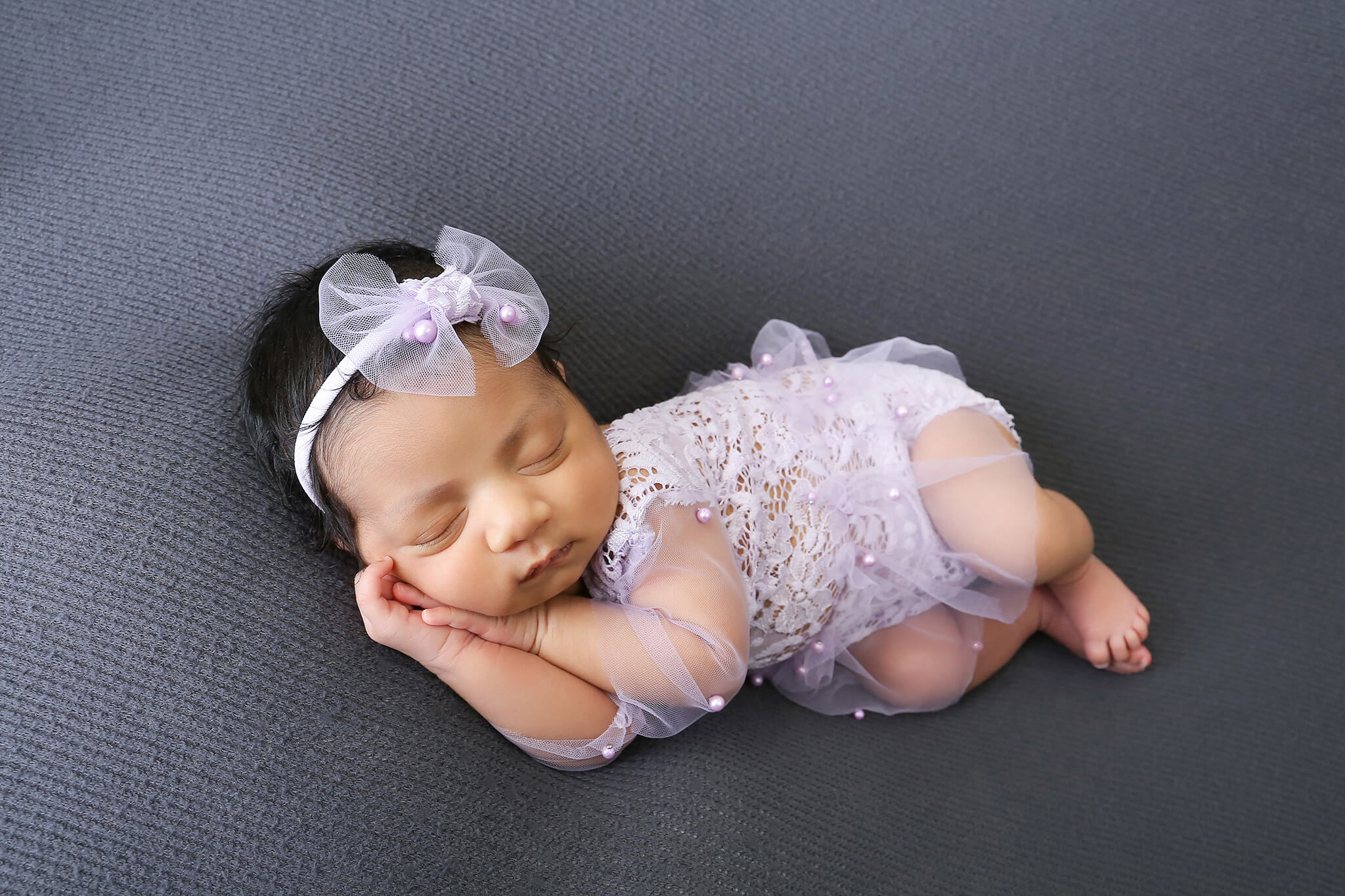 Sleepy baby girl photographed by a Windsor Colorado newborn photographer