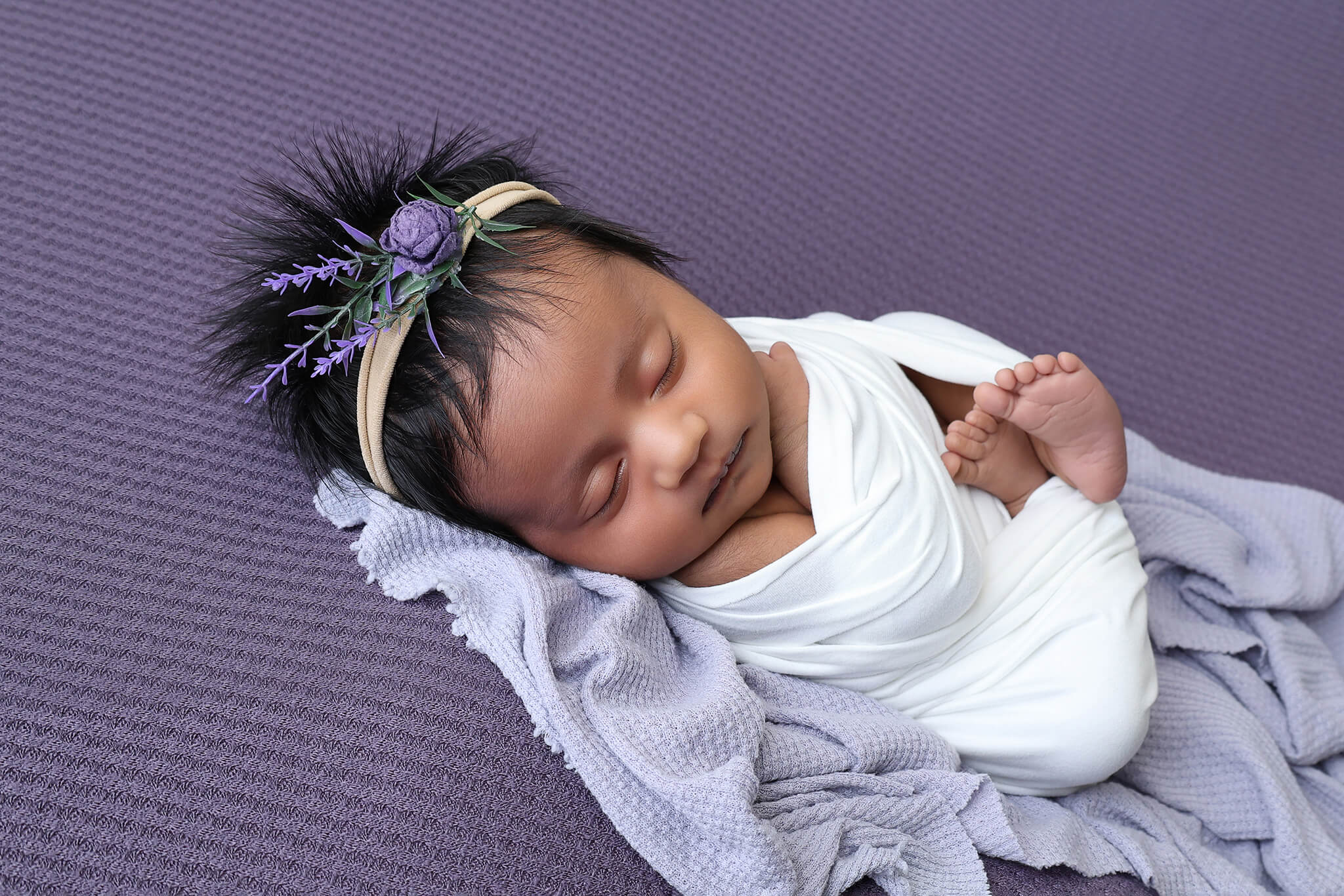 Wrapped newborn mini session photographed in Windsor Colorado